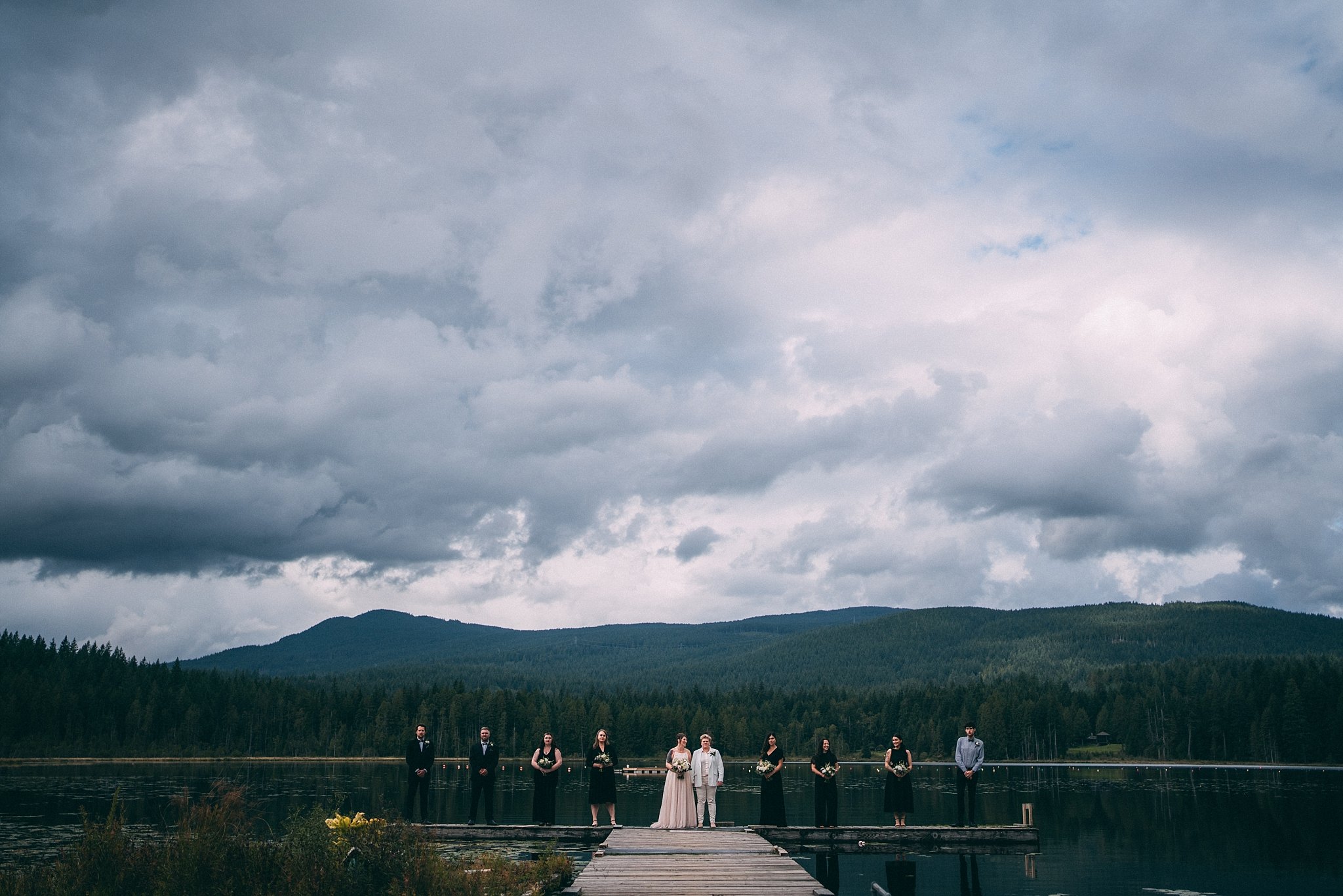 wedding party standing on dock at whonnock lake