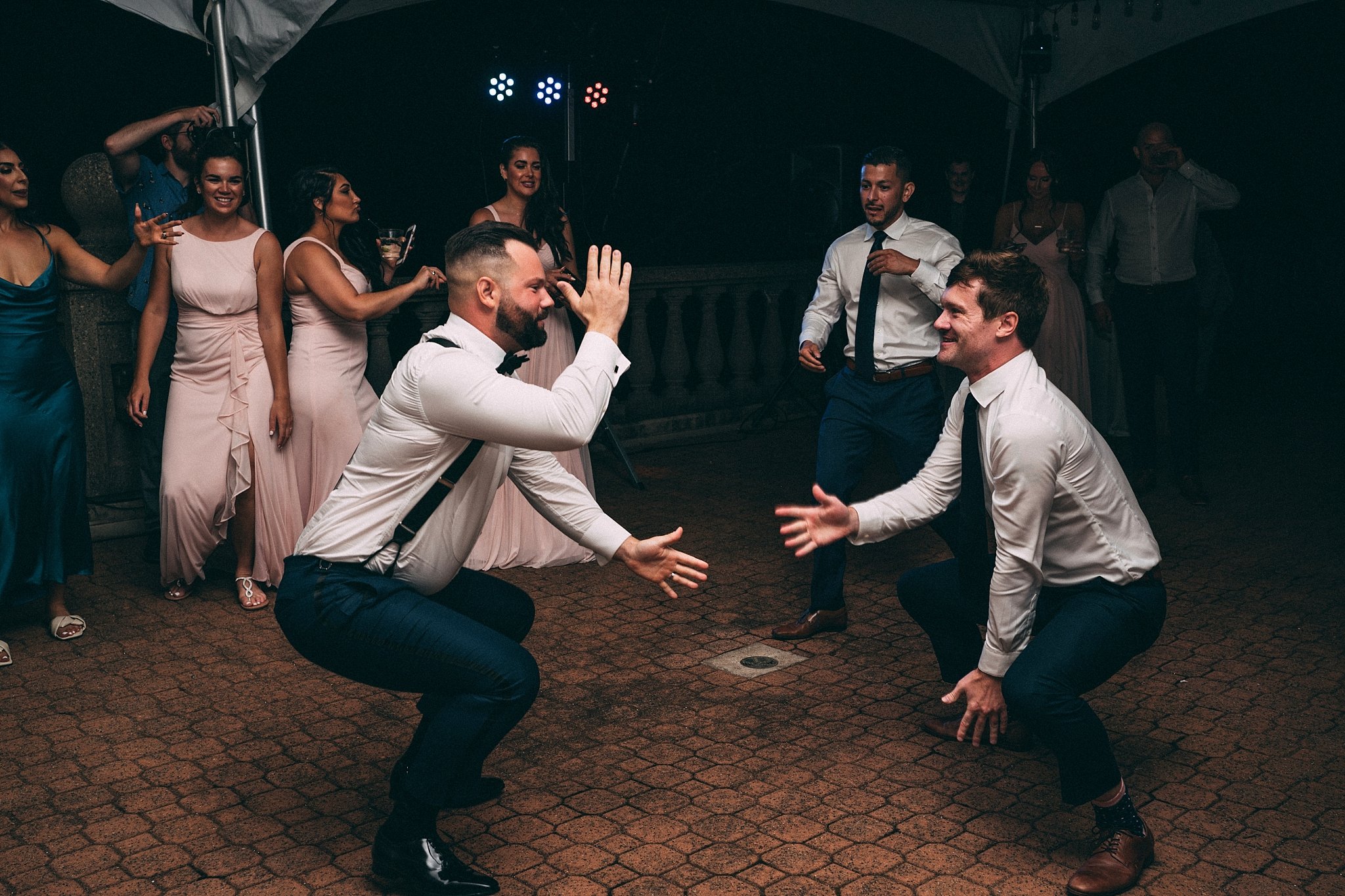 groom dancing with groomsmen