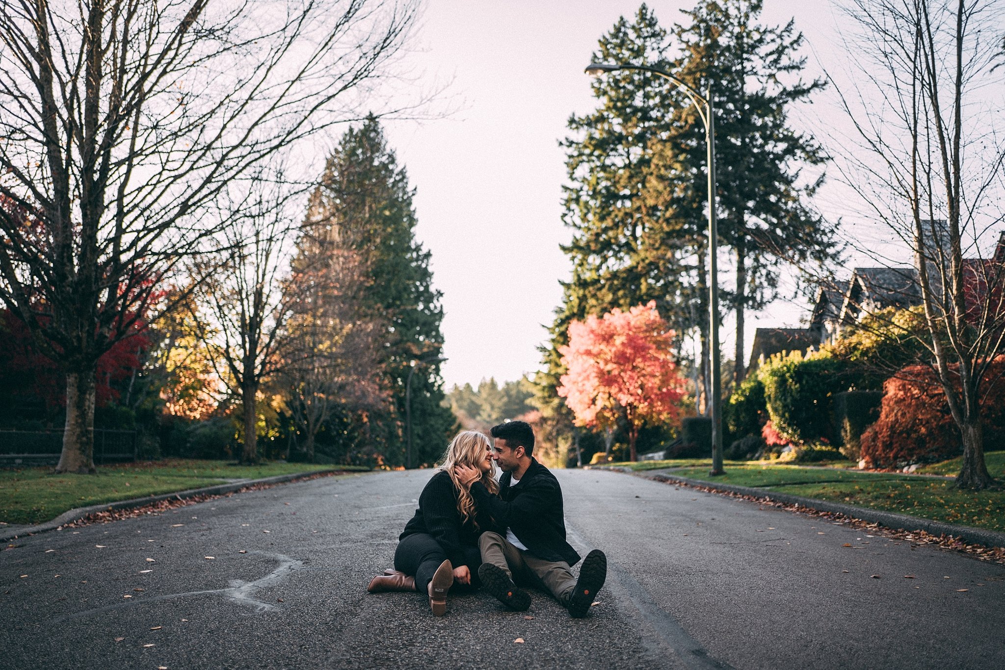 couple sitting in middle of vancouver street