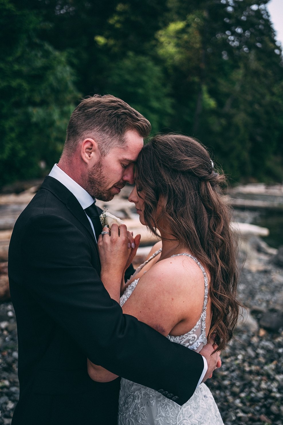 bride and groom cuddling at vancouver island