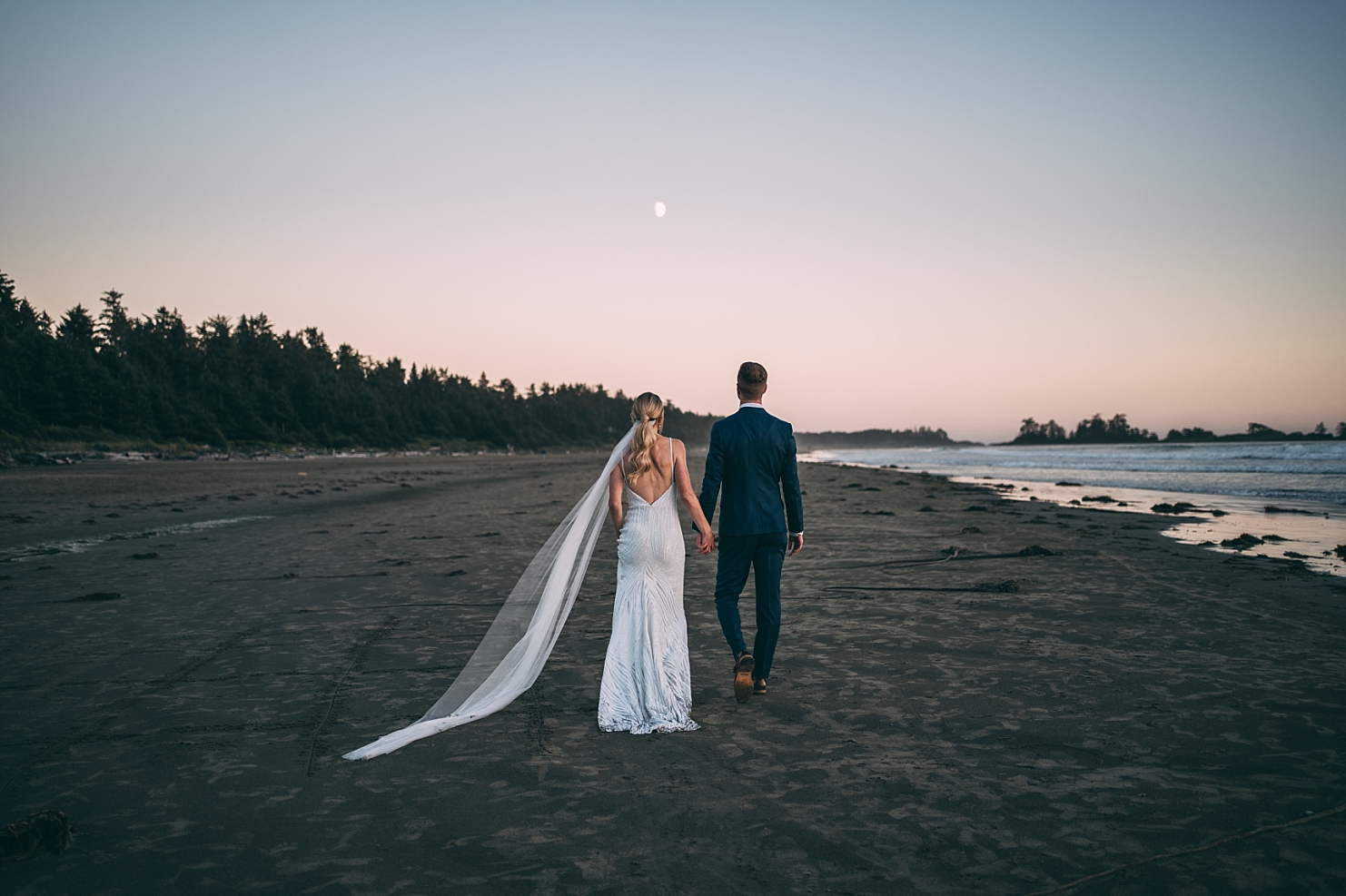 Chesterman Beach Tofino Sunset elopement couple walking towards moon