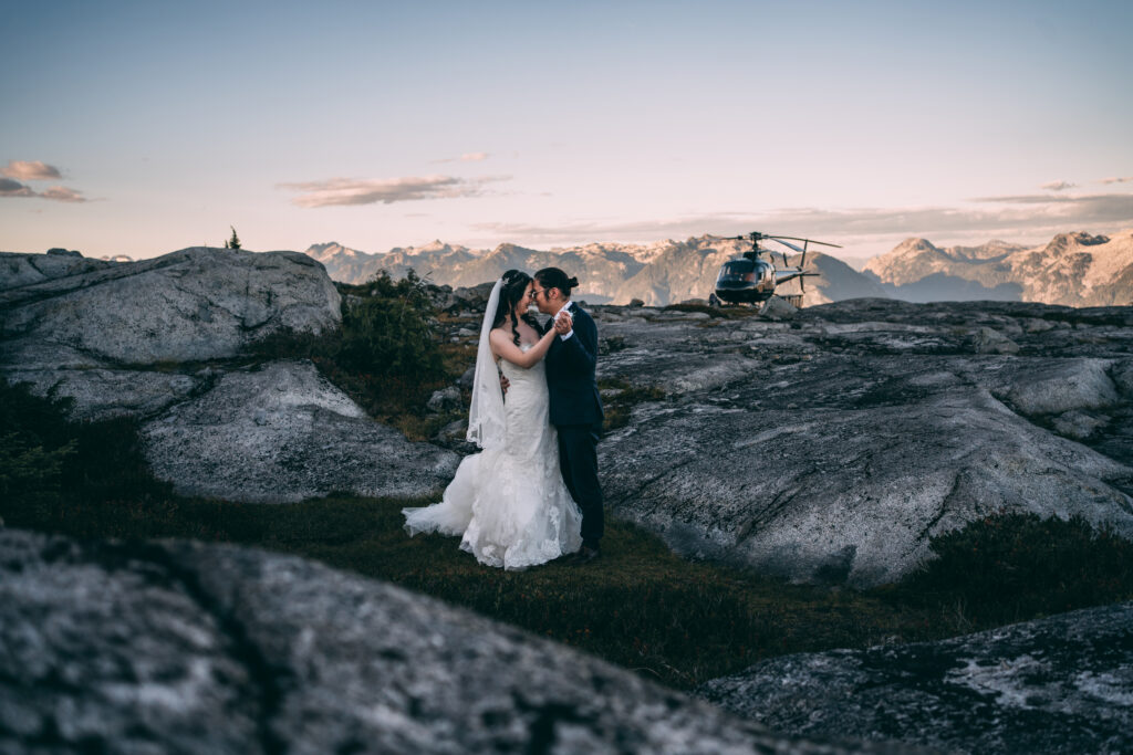 mountain top elopement sky helicopters